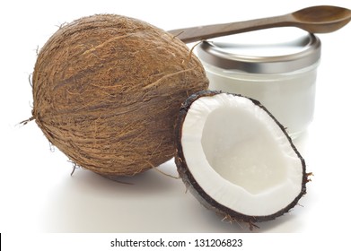 Coconut And Organic Coconut Oil In A Glass Jar On White Background.