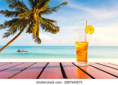 coconut palm trees and Juice drinks on a tropical beach. outdoor activities, taking a photo, swimming, wave surfing, and bikini. - Powered by Shutterstock