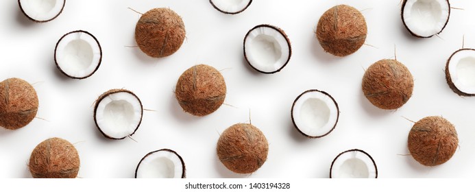 Coconut pattern on white background. Half of coconut in minimal flat lay style