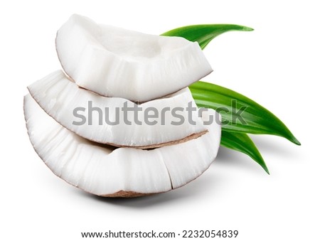 Coconut piece with leaves isolated. Coconut pieces on white background. Broken white coco slice with clipping path. Full depth of field.