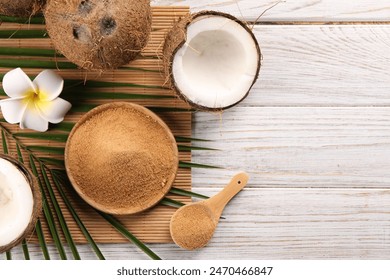 Coconut sugar, palm leaves, fruits and bamboo mat on wooden rustic table, flat lay. Space for text - Powered by Shutterstock