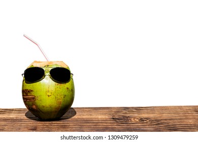 coconut with sunglasses on wood, white background, space for text - Powered by Shutterstock