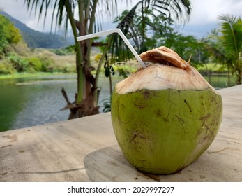 Coconut Water Drink, With Nature And Lake In The Background.  Located In Garut Regency, Indonesia