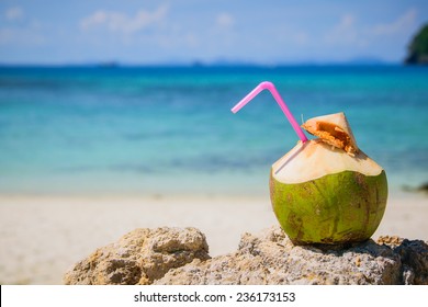 Coconut water drink  on a tropical beach 