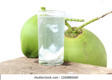 Coconut Water In Glass On Wooden 