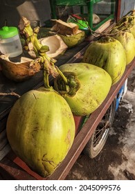 Coconuts arranged in the tradional cart for sale in street food 