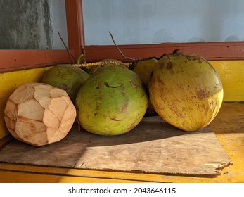 Coconuts in the corner of cart for sale in street foot corner