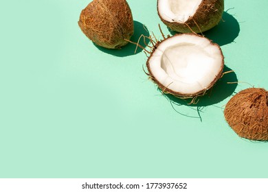 Coconuts on a blue background. Copy space