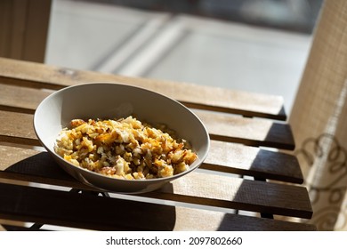 cod al douro, typical dish of cod, onion and cut potato, fry over vegetable oil. Freshly cooked dish
