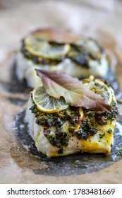 Cod fillets with coriander crust, lemon and bay leaf 