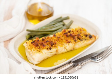 Cod Fish With Corn Bread And Green Beans On Dish