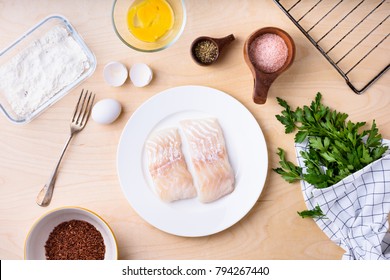 Cod Fish Fillets With Cooking Ingredients On Wooden Kitchen Table. Healthy Diet.Top View, Flat Lay.