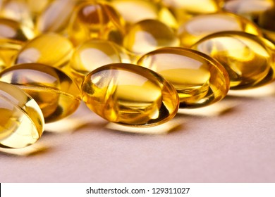 Cod Liver Oil Omega 3 Gel Capsules Isolated On Pastel Background