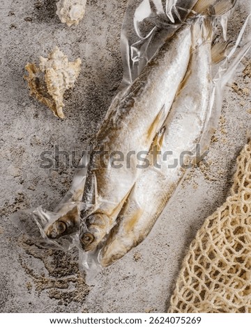 cod in a package on a gray background. High quality photo
