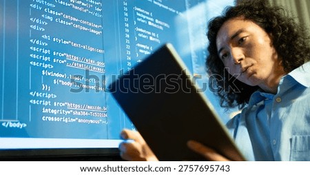 code analyst using big display, software developer focused on debugging with extensive monitor setup