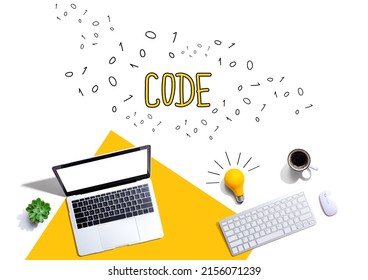 Code with computers and a light bulb