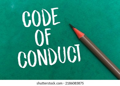 Code Of Conduct Concept With Pencil On Green Background