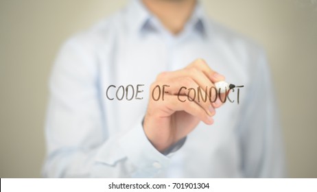 Code of Conduct, Man writing on transparent screen - Shutterstock ID 701901304