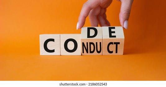 Code of conduct symbol. Businessman hand Turnes cubes and changes word Conduct to Code. Beautiful orange background. Business and Code of conduct concept. Copy space - Shutterstock ID 2186052543