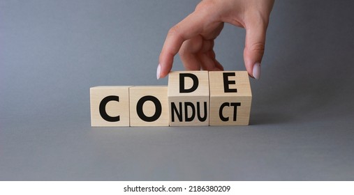 Code of conduct symbol. Businessman hand Turnes cubes and changes word Conduct to Code. Beautiful grey background. Business and Code of conduct concept. Copy space - Shutterstock ID 2186380209