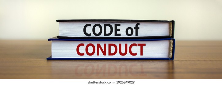 Code of conduct symbol. Concept words 'Code of conduct' on books on a beautiful wooden table, white background. Business and code of conduct concept. Copy space. - Shutterstock ID 1926249029