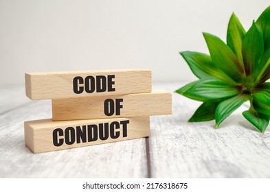 Code of conduct symbol. Concept words Code of conduct on wooden blocks on white background - Shutterstock ID 2176318675