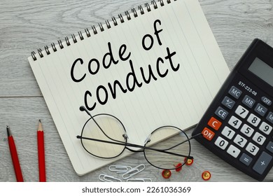 Code of conduct symbol. red pencils and glasses near notepad with text - Shutterstock ID 2261036369