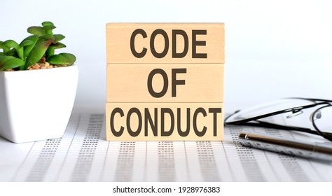 CODE OF CONDUCT text on cubes on chart background