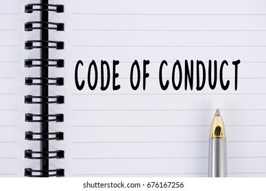 Code Of Conduct Word On Notepad With Pen