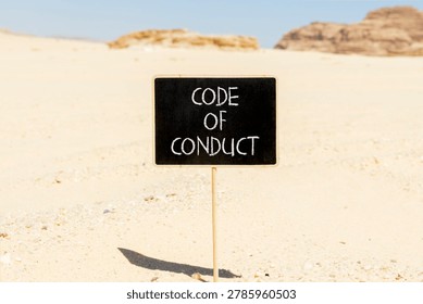 Code of conduct words symbol. Concept words Code of conduct on beautiful blackboard. Beautiful Sinai desert sand background. Business Code of conduct concept. Copy space.