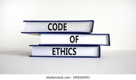 Code Of Ethics Symbol. Books With Words 'code Of Ethics' On Beautiful White Table, White Background. Business And Code Of Ethics Concept. Copy Space.