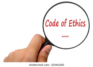 Code of Ethics word. Magnifier and puzzles.