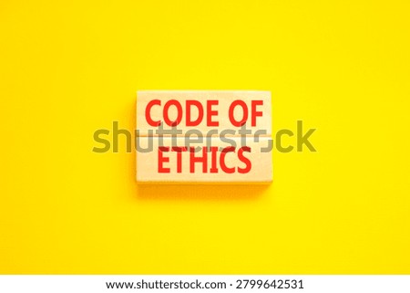 Code of ethics words symbol. Concept words Code of ethics on beautiful wooden blocks. Beautiful yellow background. Business Code of ethics concept. Copy space.
