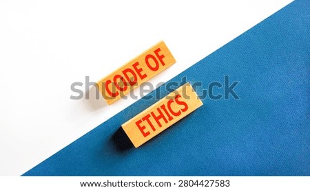 Code of ethics words symbol. Concept words Code of ethics on beautiful wooden blocks. Beautiful blue white background. Business Code of ethics concept. Copy space.
