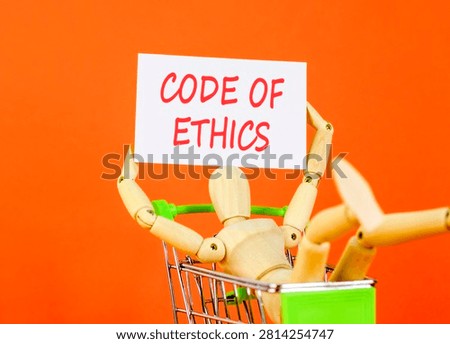 Code of ethics words symbol. Concept words Code of ethics on beautiful white paper. Beautiful orange background. Businessman model. Business Code of ethics concept. Copy space.