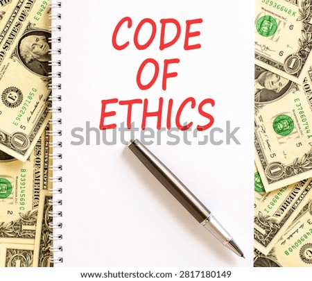 Code of ethics words symbol. Concept words Code of ethics on beautiful white note. Beautiful dollar bills background. Dollar bills. Business Code of ethics concept. Copy space.