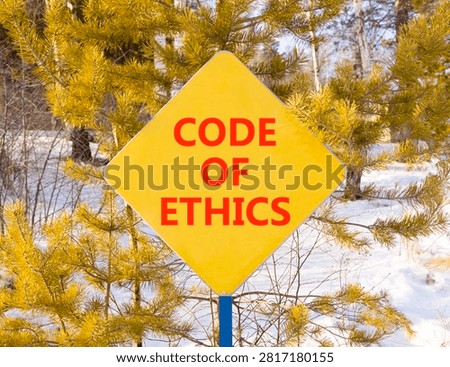 Code of ethics words symbol. Concept words Code of ethics on beautiful yellow road sign. Beautiful winter forest background. Business Code of ethics concept. Copy space.