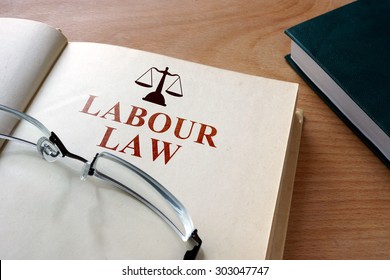 Code Of Labour  Law On A Wooden Table.