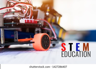 Code of learning construction car robotics on electronic board with equipment in laboratory of school.Concept of STEM education related of mathematics engineering science technology study for children