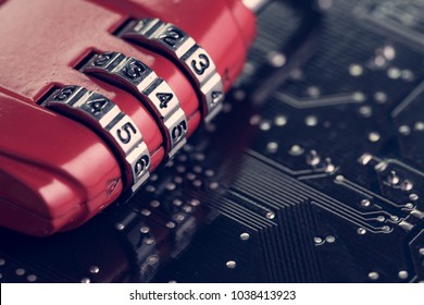 Code Numbers On Combination Pad Lock On Computer Circuit Board With Solder, Digital Cyber Safety Or Security Encryption Concept, Technology To Encode Online Information Or Data Protection.