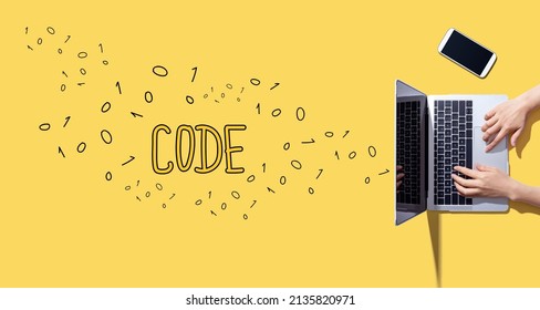 Code with person working with a laptop