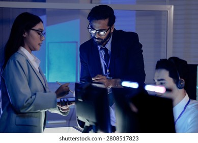 Code review huddle ignites problem solving Senior dev guides colleagues analyzing script tablet screen shows logic fix discussed modern dev hub collaboration conquers challenges now win.