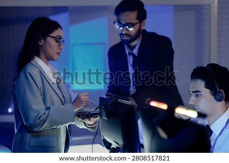 Code review huddle ignites problem solving Senior dev guides colleagues analyzing script tablet screen shows logic fix discussed modern dev hub collaboration conquers challenges now win.