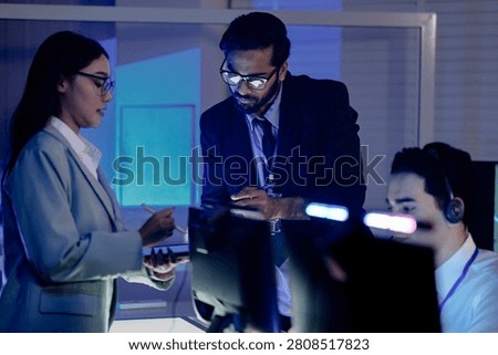 Code review huddle ignites problem solving Senior dev guides colleagues analyzing script tablet screen shows logic fix discussed modern dev hub collaboration conquers challenges now win.