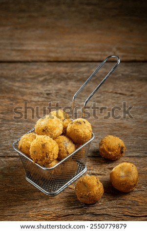 Codfish dumplings. fried dumpling, cod dumpling, fish meat, bacalao bunuelos.