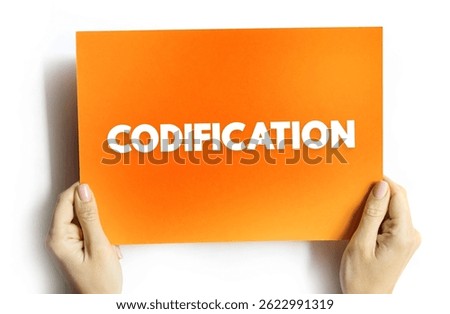 Codification - the action or process of arranging laws or rules according to a system or plan, text concept on card
