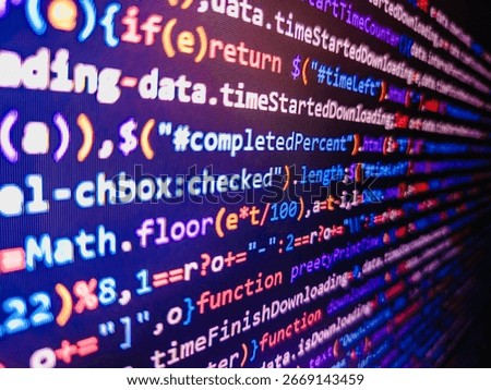 Coding, programming, hacking concept. Macro shot of binary code on the monitor of an office computer. Blue green cyan color. Computer digital background