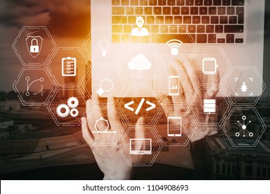 Coding software developer work with augmented reality dashboard computer icons of scrum agile development and code fork and versioning with responsive cybersecurity.Businessman hand working  VR screen - Shutterstock ID 1104908693