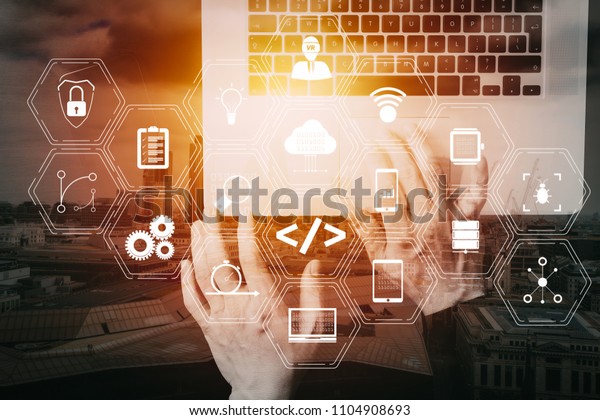 Coding software developer work with augmented\
reality dashboard computer icons of scrum agile development and\
code fork and versioning with responsive cybersecurity.Businessman\
hand working  VR screen