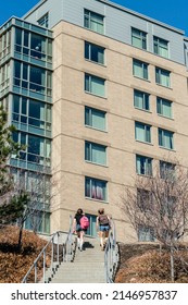 Coeds climbing stairs on the University of Pittsburgh Campus in Pittsburgh, Pennsylvania, USA, April 1, 2014